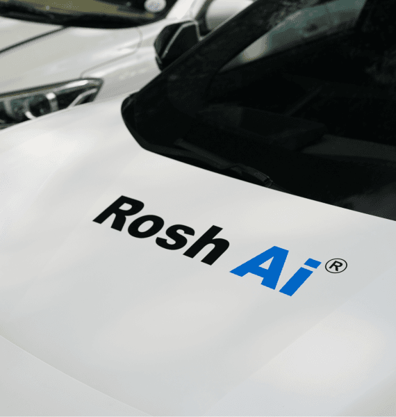 RoshAI logo on the hood of a white vehicle